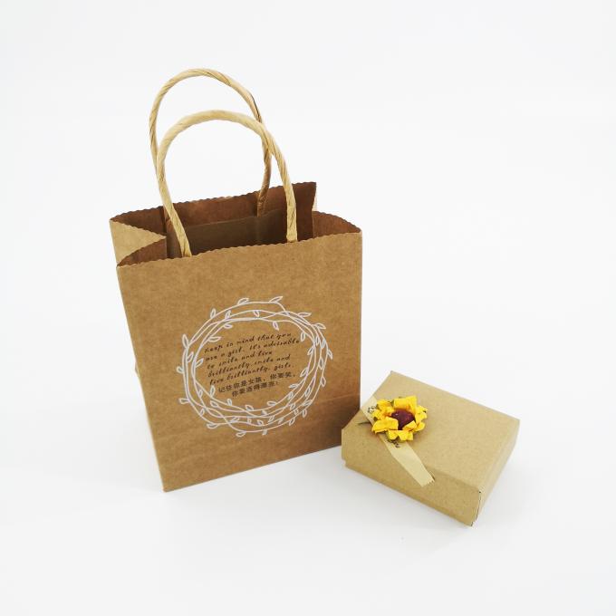 Os sacos de compras do papel do ofício de Brown imprimiram a superfície matte da laminação para o empacotamento da joia